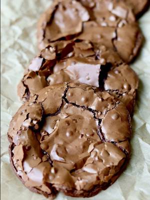 Replying to @Gavino𓍼 all the best parts of a brownie in cookie form 🍫 crinkly top + chewy + fudgy = the most delicious cross between a brownie and a cookie!  ingredients: 350g powdered sugar (a little less than 3 cups, but you can use 3 cups as well since this recipe is pretty forgiving) 60-65g cocoa powder (about 8-10 tablespoons if using tablespoons however using a scale is the best because tbsp weights may vary)– you can adjust this to 60g of cocoa powder if you prefer a sweeter cookie! 1/2 tsp salt 3 egg whites from 3 large eggs! (about 1/2 cup of liquid egg whites) 1/2 to 1 cup semi sweet chocolate chips (optional but recommended!) – depending how much chocolate you like! you can also use milk but i'm a semi sweet/dark choco girl. 1 tsp instant coffee (use 1/2 tsp if you are caffeine sensitive) 1 tsp vanilla bean paste (optional but adds great flavor) **if you live in a warm climate and your dough is super runny, try putting it in the fridge for 30-60 mins before scooping and baking** directions: preheat oven to 350°f (175°c). line a baking sheet with parchment paper and lightly butter it so the cookies do not stick. in a large bowl, add powdered sugar, cocoa powder, salt, egg whites, instant coffee, and vanilla bean paste. stir until a thick glossy batter forms. fold in the chocolate chips if you are using them. scoop 2 to 3 tablespoons of batter per cookie onto the prepared baking sheet. leave at least 4 to 5 inches between each cookie because they spread a lot while baking. four to a cookie sheet will definitely prevent them from touching, but you can fit six if you do not mind if they bake into each other a bit. place the cookie tray directly in the middle of your oven. bake for 8 to 10 minutes. at 8 minutes the cookies will cool into a very fudgy texture. the longer you bake them, the less fudgy they will be. ten minutes should be the maximum baking time. immediately after baking, use a round bowl to gently scoot and round out the cookies. this will help “fluff” up the edges, which can be a bit flat right out of the oven. remove the cookies from the baking sheet right after shaping so they do not continue cooking on the hot tray. transfer to a cooling rack and let them cool completely before eating. enjoy!!! tips: -for the fudgiest texture, stick closer to 8 minutes of baking time.  -bake in the middle of the oven to prevent burning. use good quality cocoa powder for a richer chocolate flavor.  -if you don’t like coffee, you can skip the instant coffee, but it really brings out the chocolate taste.  -make sure to leave plenty of space between cookies because they spread a lot. four to a cookie sheet will keep them from touching, six if you are fine with them touching a little.  -transfer the cookies off the baking sheet right away so they stay soft in the middle.  -immediately after baking, use a round bowl to gently scoot and round out the cookies. this helps “fluff” up the edges, which can be a bit flat straight from the oven. #brownie #cookies #flourless #baking #glutenfree 