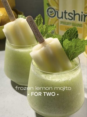 I've found the ultimate summer treat and it's these Frozen Lemon Mojito Mocktails! 🍋🍃✨ The star of the show is @outshinesnacks Lemon Fruit Bars. They're SO refreshing on their own, but also the perfect garnish for your all your favorite beverages - like this one!  Here's how to make the Frozen Lemon Mojito (for two):  6-7 mint leaves .5 oz simple syrup 1 cup soda water 1 small lemon quartered ½ tsp xanthan gum Add ice, then blend Pour into chilled glass Garnish w/ Outshine Lemon Fruit Bars + mint leaves Enjoy! 💚