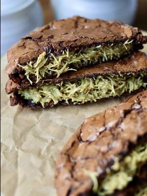 Replying to @Toni Z dubai chocolate brownie cookie sandwiches 🍪 ingredients: 350g powdered sugar 60–65g cocoa powder 1/2 tsp salt 3 egg whites from 3 large eggs! (about 1/2 cup of liquid egg whites) 1/2 to 1 cup semi-sweet chocolate chips (optional but recommended!) – depending how much chocolate you like. you can also use milk, but i’m a semi-sweet/dark choco girl. 1 tsp instant coffee 1 tsp vanilla bean paste 2 tbsp pistachio crème (optional for the cookie)  filling: 4 oz crispy kataifi (brown uncooked kataifi in butter until golden) 2-3 oz pistachio crème (you can totally eyeball this) 30g tahini (again, you can eyeball this) directions: in a big bowl, mix together powdered sugar, cocoa powder, salt, egg whites, instant coffee, and vanilla bean paste until you’ve got a thick, glossy batter. fold in chocolate chips if you’re using them. swirl in the pistachio crème (optional- the pistachio crème gets lost when baked into the cookie but the flavor is there!)  refrigerate the batter for 30–60 minutes. preheat your oven to 350°f (175°c). line a baking sheet with parchment paper and butter it so the cookies don’t stick. scoop 2–3 tablespoons of batter per cookie onto the tray. leave at least 4–5 inches between each cookie because they spread a lot. four per sheet is the safest bet!  bake in the middle rack of the oven for 8–10 minutes, until crinkly. if you pull them at 8 minutes, they’ll set into a super fudgy texture. if you bake longer, they’ll be less fudgy so 10 minutes max but this also depends on your oven. you can tell the cookies are done when the edges are set and the tops are crinkly.  right after baking, use a round bowl to scoot the edges in so the cookies look nice and round (and fluff up the edges a bit). transfer off the tray right away so they don’t keep cooking on the hot pan. let them cool completely. for the filling, mix the crispy kataifi with pistachio crème and tahini until it comes together. spread between two cooled cookies and sandwich it up. enjoy!!! #dubaichocolate #brownies #cookies #baking #chocolatecookies 