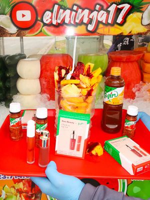@el ninja 🥷☘️🍍 🤝 Tajín Cheek and Lip Set Touching up my lipgloss while I wait for my vaso de mango con Tajín from my local fruit vendor... a dream 🥹❤️ Get yours online @sephora, @Sephora México and rarebeauty.com ❤️‍🔥  #rarebeauty #tajín #newrarebeauty #rarebeautyxtajín #fruitninja 
