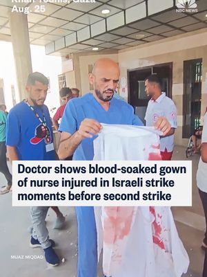 Dr. Mohammad Sukkar, the head of nursing at Nasser Hospital in #Gaza, held the blood-soaked gown of a nurse who he said was wounded in the first of two Israeli strikes at the hospital. While he is speaking, the second strike hits Nasser. #Israel says it is investigating the strikes. PM #Netanyahu called the incident a “tragic mishap.”