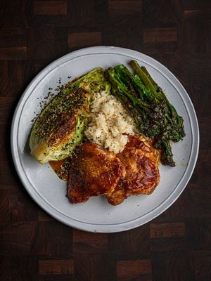 The chicken alone with just oyster sauce and salt are so juicy!  But I couldn’t leave you without a pan sauce too! Let me know in the comments if you want a video on the cabbage and broccoli too. Chicken 4 skin-on chicken thighs 3 tbsp oyster sauce Salt to season 1. Season the chicken skin liberally. 2. Start with a cold pan and no oil. I like to use a stainless steel pan as it gives great sucs (all the gubbins left at the bottom of the pan that some people call fond). 3. Start pan frying on medium low. If you’re unsure go lower than you think you need to. You can always turn it up later. 4. As the skin cooks the Maillard reaction will happen (the browning) and it will start to unstick. 5. Once you have the colour you want on the skin brush the it with the oyster sauce and place the whole thing in the oven. Clearly you need an oven-safe pan for this. 6. Cook at 180°C for 5 minutes and you should find the internal temperature is over 75°C. You can rest these under some kitchen foil on the counter top whilst you make the sauce, or you can leave them in the oven with the door ajar until the oven cools to around 40°C. They’ll keep at that temperature for easily 30 minutes. Pan Sauce 1 medium shallot 1 clove garlic, minced 1cm piece of peeled & minced ginger 80ml dry vermouth 1 tsp light soy sauce 1/2 tsp fish sauce 1 tsp rice vinegar 1 tsp mirin 200ml chicken stock 2 tsp lime juice 3 tbsp butter  1. Bring the pan to a medium heat and add the shallots. Cook until translucent. 2. Add in the minced garlic and ginger and cook for another minute. 3. Deglaze with some dry vermouth and reduce until ‘jammy’. 4. Add in the soy sauce, fish sauce (I used dark soy in the video which you can also do), rice vinegar and mirin. Cook for another minute. 5. Add in the chicken stock and reduce aggressively until the spatula traces through. 6. Turn the heat off to finish with lime juice and cold butter. Keep the pan moving to emulsify. **To serve** Hispi (sweatheart) cabbage with furikake Garlic & ginger Tenderstem broccoli  Sticky jasmine rice with spring onion