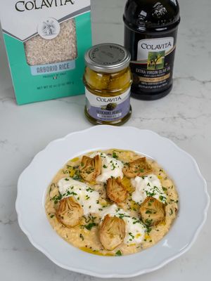 Artichoke & Burrata Risotto Artichokes are one of my favorite ingredients to cook with, they pair beautifully with both dairy and meat dishes. The moment I saw these @Colavita Artichoke Hearts in Extra Virgin Olive Oil, I knew they’d be perfect. They make a gorgeous topping for risotto while also adding depth and a satisfying bite. #colavitapartner #colavita #itstartswithcolavita Ingredients: For the risotto: 1-2 shallots, finely chopped 2 cloves garlic, peeled 4 tbsp Colavita Extra Virgin Olive Oil, divided 2 tbsp unsalted butter 1 cup Colavita Arborio Rice ¼ cup dry white wine, such as Chardonnay 3-4 cups vegetable broth (see Notes) 2 jars (9.87 oz each) Colavita Artichoke Hearts in Extra Virgin Olive Oil, halved About 1/2 cup grated Parmigiano Reggiano, plus extra for garnish Fine sea salt, to taste ½ tsp freshly ground black pepper (optional) Zest of 1 lemon 8 basil leaves, chopped just before adding For serving: 2 tbsp fresh parsley, chopped 2 burrata, torn Drizzle of Colavita Extra Virgin Olive Oil, optional Freshly ground black pepper, to taste Instructions Sear the artichokes: In a large skillet, heat 2 tbsp olive oil over medium-high heat. Add the whole garlic cloves and let them infuse for 30 seconds. Add the halved artichokes, cut side down, and sear for 2-3 minutes until golden. Flip and cook for another 2 minutes. Remove the artichokes and garlic and set aside. Reserve about 6 artichoke halves per serving for garnish, and roughly chop the rest. Start the risotto: In the same skillet, add a bit more oil if needed, then add the shallots. Sauté for 3-4 minutes until softened and lightly golden. Stir in the rice and toast for 2 minutes. Pour in the wine and cook for 1-2 minutes, stirring until mostly absorbed. Reduce heat to medium-low. Add the broth one ladleful at a time, stirring frequently and letting each addition absorb before adding more. Continue until the rice is creamy and tender, about 20-25 minutes. Stir in the lemon zest, chopped artichokes, salt, and black pepper (remember Parmigiano will add salt). Remove from heat and stir in the butter, grated Parmigiano, and basil. Taste and adjust seasoning as needed. Serve: Spoon into shallow bowls. Top each serving with torn burrata, the reserved seared artichokes, parsley, and a drizzle of extra virgin olive oil. Finish with black pepper if desired. Serve immediately. Notes If you can’t find high-quality butter or Parmigiano Reggiano, add 2-4 tbsp (⅛–¼ cup) heavy cream at the end to help enrich the risotto. It’s not traditional, but it will give you a creamy result. Creamy risotto, Date night dinner, Cozy dinner recipes, Weeknight Italian, Creamy rice dish