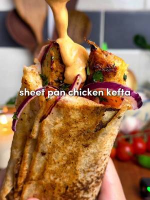 Sheet Pan Chicken Kefta Wraps 🔥  All the flavor, none of the fuss... juicy spiced chicken, roasted garlic sauce, and a zesty salad. Inspo from the recipe king: @Zachary Neman  For the Chicken Kefta: -1.5–2 lbs ground chicken (700-900 g) -2 tbsp tomato paste -8 garlic cloves, minced -2 tsp smoked paprika, 2 tsp cumin, 2 tsp salt, 2 tsp black pepper, 1 tsp turmeric, 2 tsp garlic powder -1/3 cup fresh parsley, chopped -1/3 cup fresh cilantro, chopped (optional) -1 large or 2 medium yellow onions, grated + squeezed dry* -On top before baking: 4 tbsp olive oil For the Roasted Garlic: -2 garlic heads, 1 tbsp olive oil and 1 tsp salt For the Fresh Salad: -1/2 large red onion, thinly sliced -1 cup cherry tomatoes, quartered -1/4 cup fresh parsley, chopped -1 tsp salt, 1 tsp pepper & 2 tsp sumac -Juice of 1/2 lemon Roasted Garlic Paprika Sauce: -Roasted garlic cloves, 1/4 cup mayo, 1/4 cup Greek yogurt, juice of 1/2 lemon, 1 tsp paprika + 1 tsp pepper 1. Preheat oven to 400°F (205°C). Slice the tops off two garlic heads, drizzle with olive oil and salt, wrap in foil, and roast for 45–60 minutes until golden and soft. While the garlic roasts, prep the kefta. 2. Grate the onion, squeeze out all liquid with paper towel or cheesecloth. (This prevents watery kefta.) In a large bowl, combine chicken, tomato paste, minced garlic, spices, parsley, cilantro (if using), and the grated onion. Mix with your hands for 2–3 minutes until sticky and well combined. 3. Spread onto the sheet pan in a 1/2-inch (1.25 cm) thick rectangle. With a knife, score into 1-inch strips (2.5 cm). Drizzle evenly with 4 tbsp olive oil. 4. Bake for 12–15 minutes, then broil 2–5 minutes until golden and slightly crisp on top. 5. While baking, toss onion, tomatoes, parsley, salt, pepper, sumac, and lemon juice in a bowl. 6. Squeeze roasted garlic cloves into a bowl, mash, then mix with mayo, yogurt, lemon juice, paprika, and pepper until smooth. 7. On lavash or pita, slather sauce, add 1–2 strips of chicken kefta, top with salad. Roll tight. For extra magic, crisp the wrap in a lightly oiled skillet for 1-2 mins per side.