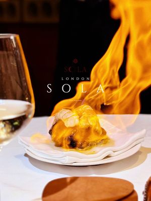 ✨ A GOLDEN STATE OF MIND AT SO|LA ✨ 📍SO|LA 🇬🇧64 Dean Street, Soho, London, W1D 4QQ, United Kingdom Just had the most incredible evening at **SO|LA** in Soho! 🌟 This Michelin-starred gem transported me straight to California without leaving Dean Street 🛫✈️ Walking into this intimate space feels like stepping into a lush LA oasis 🌿🌴 The sculptural lighting and abundant greenery immediately set that Golden State vibe - pure magic! ✨ Chef Victor’s creative Californian cooking is next level! Started with their iconic “Devilled Egg Since Day 1” - smoked sturgeon with gochujang that literally made my taste buds dance 💃🥚 The vodka-cured salmon roulade with wasabi and sweet potato? 😘👌 But honestly, every single dish was a work of art. That O’Toro with Kindai bluefin and kohlrabi had me questioning everything I thought I knew about sashimi 🍣🔥 The langoustine “nabemono” flambéed in whiskey was pure theater! 🎭🔥 And don’t even get me started on the Iberico “Royale” with black truffle - absolute perfection 🐷✨ Ended with their signature chocolate cake topped with… CAVIAR?! 🍫🖤 Sounds wild but trust the process - it’s genius! The all-American wine list perfectly complemented every course 🍷🇺🇸 Service was impeccable with just the right amount of theatrical flair! #SOLALondon #MichelinStar #CalifornianCuisine #SohoEats #LondonRestaurants 