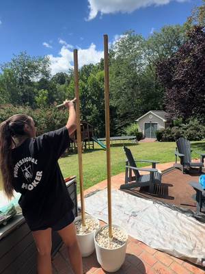 Finally did this DIY String light pole planters with a sunshade! Also grabbed one of my husbands shirts so I wouldn’t ruin mine and wasn’t aware the back said that until editing this 🤣🤣🤣 #stringlights #DIY #patio #easydiy #homeproject 