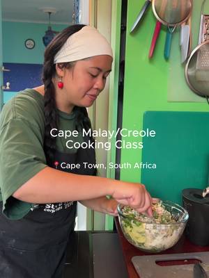 Cape Malay cooking class 🎀  — Have you heard of Cape Malays and their history? To know Cape Town is to know the Cape Malay community and their stories!! Brought here in the 1600s from South + Southeast Asia through Dutch slavery and exile, they’ve shaped the city in SO many ways: religion, music, language, apartheid resistance, and of course, food 🍽️ Their cuisine has significantly contributed to South African cuisine with a blend of flavors from Asia, Africa, and Europe. You can even see it in this video: we made roti, chili bites (fritters), butter chicken, and malva pudding… dishes you might recognize from other cultures, but with a Cape Town twist. This class with Unexplored Cape Town (not sponsored, I just LOVE them sm) was the sweetest experience. It was especially amazing, taking it a few days after their food tour. This class was soooooooooo fun, it felt like I was at home cooking with lifelong friends <3 Shihaam and Janop, thank you for sharing your family recipes, culture, and life with me. This was the BEST way to end my food blogger trip to Southern Africa, and I’m so glad I made this video to have this memory forever and ever. #bitesbybianca #capetowntourism #capetownevents #nyccreator #travelcreator 