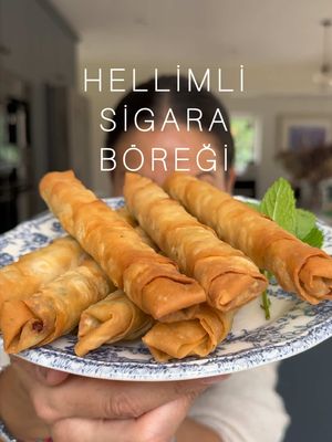 HELLİMLİ SİGARA BÖREĞİ (Hellim-Filled Cigar Shaped Filo Rolls).  We didn’t grow up eating these at home, as my mum would always make the Cypriot-style rectangular fried börek (fried and baked pastries) with her homemade yufka (pastry) instead. However, we did grow up eating Sigara Böregi every time we were served hot meze at a restaurant in Kıbrıs or at weddings / balos (dinner and dances). They are called Sigara Böregi because of their shape. Filled with a herby cheese filling that becomes deliciously oozy once fried, they must be eaten hot. So hot, in fact, that due to my impatience, I can rarely feel the roof of my mouth after eating them. They can be made with hellim (halloumi) or beyaz peynir (white cheese such as Turkish “Lor Peyniri” or Cypriot “Nor” (anari)), similar to feta, but I make mine using a combination of grated, fluffy “hellim” and tangy, crumbly “beyaz peynir” or “nor”. Full recipe in Meliz’s Kitchen and method also continued and pinned in comments.  INGREDIENTS Makes 14 1 large egg 100 g (3½ oz) beyaz peynir (Turkish white cheese) or feta 250 g (9 oz) hellim (halloumi), finely grated 25 g (1 oz) fresh flat leaf parsley leaves (stalks removed), finely chopped 10 g (¼ oz) fresh mint leaves (stalks removed), finely chopped ½ tsp dried mint ½ tsp pul biber 14 triangular-shaped sheets of “üçgen yufka” filo pastry 500 ml (18 fl oz) rice bran / light olive / cold-pressed rapeseed / sunflower/ vegetable oil, for frying ***Note If you can’t find triangular üggen yufka pastry, then you can use regular filo sheets cut into triangles. However, please note that these filo sheets are a lot thinner, so the texture of the cigars will differ. #börek #pastry #baking #delicious#baking