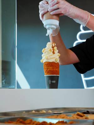Pumpkin Spice is HERE. ✨ Layered with rich pumpkin, warm spices, cheesecake bites, and cookie butter drizzle—this one tastes like fall in a cone. 🍂 Get it this weekend before it’s gone. 🖤