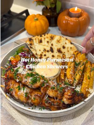 HONEY GARLIC PARMESAN CHICKEN SKEWERS For 2 portions: For the chicken: - 300g chicken breast  - 1 tsp chicken seasoning, onion granules/powder, paprika & parsley  - 1tbsp honey - 10g parmesan  For the potatoes: - 400g potatoes  - Tsp smoked paprika, aromat, garlic granules & oregano  - Tbsp hot honey  - Tbsp Parmesan  Hot honey mayo: - 4tbsp light mayo  - 2tbsp hot honey  - 2tbsp sweet chilli  Cut your potatoes into chips, then add these to water. Boil for 4 minutes, then drain, pat dry and add to your aifryer basket with the seasonings. Cook for 20 minutes and finish with the honey, Parmesan and fresh parsley. For the chicken cut into thin even size strips (this helps it cook more evenly) then combine everything in a bowl leave the chicken to marinade for 10/15 minutes.  Once you’re ready thread the chicken onto skewers, I cooked mine in my airfryer, I did them at 190 for 12 minutes. Brush over some of the honey mayonnaise once cooked and sprinkle over the parmesan & parsley.  • • • #fyp #quickdinnerideas #quickmeals #EasyRecipes  #hothoneychicken  