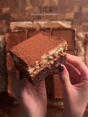 tiramisu brownies brownies: 2 eggs 1/2 cup (42g) cocoa powder 1/2 tsp (3g) each salt and baking powder 1 1/2 tsp (6g) vanilla 1/2 cup (113g) unsalted butter (melted) 1 cup (200g) sugar 3/4 cup (90g) flour 2 tsp (4g) espresso powder 1/2 cup chocolate chips *mix together eggs, cocoa powder, salt, baking powder, instant espresso, and vanilla. in a separate bowl cream butter and sugar, then microwave gradually (15 sec at a time) until sugar dissolves and is shiny. combine the egg and butter mixtures well, then add flour and mix gently, do not overmix. add chocolate chips and fold until combined. pour into a 9x9 pan and bake at 350 for 28-30 min. mocha coffee ganache 1/2 cup (85g) chocolate (I used bittersweet) 1 tsp (2g) espresso powder in 3 tbsp (45g) hot water 1/4 cup (60g) heavy cream *finely chop the chocolate. set this in a bowl. in a smaller bowl, microwave the heavy cream in the microwave slowly (20 sec increments). pour the hot heavy cream into the chopped chocolate and add in the espresso. mix well until smooth, and pour on top of semi cooled brownie. set in the fridge for an hour before adding the lady fingers.  ladyfingers in espresso 16 ladyfingers soaked in 2 tsp (4g) espresso powder dissolved in 6 tbsp (90g) hot water *gently and quickly dip the lady fingers in the espresso, making sure to get both sides and place on the cooled blondie/ganache. mascarpone cream 1 cup (225g) mascarpone 1/2 cup (120g) whipping cream 1/2 cup (60g) powdered sugar 1/2 tsp (2g) vanilla whip the mascarpone and then add the whipping cream and vanilla. mix until combined and then add the powdered sugar. Layer it on top of the lady fingers. cocoa powder for dusting! #tiramisu #brownies #baking #Recipe 