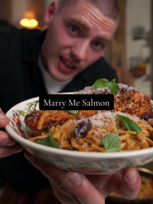 Marry Me Salmon Pasta 🔥 Ingredients 	•	3 salmon fillets, skin on (about 150g each) 	•	250g linguine 	•	1 tbsp olive oil 	•	1 small onion, finely diced 	•	3 garlic cloves, finely chopped 	•	2 tbsp sun-dried tomato paste (or chopped sun-dried tomatoes) + olives if you fancy! 	•	1 tsp dried oregano 	•	1 tsp smoked paprika 	•	½ tsp chilli flakes (optional) 	•	200ml chicken or vegetable stock 	•	150ml single cream (or double for richness) 	•	30g Parmesan, finely grated (plus more to serve) 	•	Handful fresh basil leaves, torn 	•	½ lemon, juiced 	•	Salt & black pepper 1.	Cook the pasta (10 mins): Bring a large pot of salted water to the boil. Add linguine and cook until al dente (about 8-9 minutes). Drain, reserving a mug of pasta water, and rinse briefly to stop it cooking further. 	2.	Cook the salmon (6-7 mins): Heat olive oil in a large pan over medium heat. Season salmon with salt and pepper. Place skin-side down and cook for about 80% of the time on this side (5-6 minutes), then flip for 1 minute until just cooked through (internal temp around 55°C for medium). Remove and rest. 	3.	Build the flavour base (4 mins): In the same pan, add onion with a pinch of salt and cook until softened. Stir in garlic, sun-dried tomato’s or paste, oregano, smoked paprika, and chilli flakes. Cook for 1 minute until fragrant. 	4.	Make the sauce (5 mins): Pour in stock, simmer for 2 minutes, then reduce heat and stir in cream and Parmesan. Let bubble gently until slightly thickened. Add basil leaves, olives if using and toss in the cooked linguine, loosening with a splash of pasta water until silky. 	5.	Finish and serve: Squeeze over lemon juice, then plate the linguine with salmon fillets laid on top. Finish with extra Parmesan and fresh basil. Top Tips 	•	Crisp skin is all about patience – don’t move the salmon until it naturally releases from the pan. 	•	If you like it saucier, reserve more pasta water to swirl through at the end. 	•	A little lemon zest grated over the top gives even more freshness. Serves 3 Nutrition (per serving): Calories: 615 Protein: 42g Carbs: 54g Fat: 25g Fibre: 4g #fromscratch #familydinner #30minutemeals 