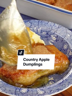These Country Apple Dumplings are made with the usual suspects: apples, dough, butter, and....wait, MOUNTAIN DEW?!🥤 As it turns out, Mountain Dew is the key to the perfect ooey-gooey dumpling! Continue reading or click the link in the @allrecipes bio for the full recipe! 🔗 Ingredients: 2 large Granny Smith apples, peeled and cored 2 (10 ounce) cans refrigerated crescent roll dough 1 cup butter 1 ½ cups white sugar 1 teaspoon ground cinnamon 1 (12 fluid ounce) can or bottle Mountain Dew Directions: Preheat the oven to 350 degrees F (175 degrees C). Grease a 9x13-inch baking dish. Cut each apple into 8 equal wedges; set aside. Separate crescent roll dough into triangles. Roll each apple wedge in crescent roll dough starting at the smallest end. Pinch to seal and place in the prepared baking dish. Melt butter in a small saucepan over low heat. Stir sugar and cinnamon into melted butter until combined. Pour over apple dumplings, followed by soda. Bake in the preheated oven until golden brown, 35 to 45 minutes. 🧑‍🍳: Nicole #countryapple #appledumplings #dessert #easydesserts 