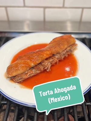 Torta Ahogada (Mexico) on Sandwiches of History⁣  We’re headed to Mexico for today’s International Sandwich Sunday. More specifically for the Torta Ahogada. This sandwich features carnitas which is pork cooked in its own fat, then crisped up on the plancha or grill top. It also has refried beans, two different salsas, and, unlike many other torts, is served on a sourdough roll called a Birote Salado. It is a lot and as you’ll see in the video, I do use some shortcuts because, you know, time. #fyp #sandwichesofhistory 