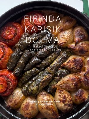 Fırında Karışık Dolma (Baked Stuffed Vegetables & Leaves). Full recipe on my blog and in Meliz’s Kitchen.  Serves 6–8 4 large onions 6 ripe tomatoes 400g (5½ oz) Swiss / rainbow chard (with stalks on)  50 g (1¾ oz) fresh flat leaf parsley 3 tbsp olive oil 1 tsp pul biber ¼ tsp paprika ½ tsp ground cinnamon ½ tsp ground cumin 1 tsp salt 1 tsp coarse black pepper 2 tbsp Turkish sweet red pepper paste (tatlı biber salçası) 3 tbsp tomato purée 250 g (9 oz) short grain rice  1 tbsp dried mint 1 tbsp pomegranate molasses 4 tbsp fresh lemon juice 4 tbsp extra virgin olive oil 50 g (1¾ oz) pine nuts 16 vine leaves 1 chicken or vegetable stock cube 400 ml (14 fl oz) boiling water 200 ml (7 fl oz) cold water 30 g (1 oz) unsalted butter ¼ tsp pul biber #dolma #sarma #vegetables #fyp 