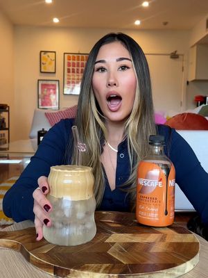 @tinaprovis showing us how she hacks a Cloud Iced Latte using NESCAFE Espresso Concentrate Rich Caramel #nescafecoldhacks#pouritmixithackit#coffeetok #cloudicedlatte