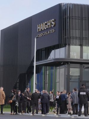 We’re proud to share an exciting new chapter in the Haigh's Chocolates story. Our new $120 million, state-of-the-art production, warehouse and online fulfilment facility in Salisbury South, South Australia has officially opened. Built to support our ongoing growth and commitment to delighting chocolate lovers across the country, the 18,000m² site will increase our production capacity from 1,100 to 2,000 tonnes of chocolate per year. It also features 1,180 solar panels, 1.7km of chocolate delivery pipes, and over 5km of storage space – all designed to keep our artisan chocolate making thriving for generations to come. This is just the beginning of a delicious future. Thank you for being part of the journey. 💛