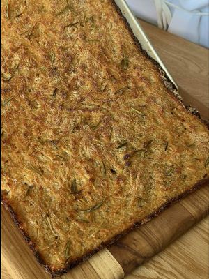 🇮🇹Schiacciata di Cipolle  Easy Italian Appetizer! This Schiacciata di Cipolle is golden, crispy, and packed with onions! the perfect snack for parties, aperitivo, or whenever you’re craving something savory. Save this recipe for your next charcuterie board or party spread!  Ingredients: 1.5lb onion 300g 00 flour 330g water 75g breadcrumbs 50g Parmigiano Reggiano  Fresh rosemary Salt & pepper Olive oil Semolina flour (for sprinkling) Directions: 1. Slice the onion thin with a mandolin and soak them in water for a few minutes. 2. In a large bowl, whisk together the flour and water to form a batter 3. Add the onion, breadcrumbs, parmigiano, rosemary, salt, and pepper. Mix well. 4. Line a baking sheet with parchment paper. Drizzle with olive oil and sprinkle with semolina. 5. Spread the batter evenly. Drizzle more olive oil and sprinkle with semolina on top. 6. Bake at 400°F for 45 minutes, and then broil until crispy and golden. 🇮🇹Buon Appetito! #EasyRecipe #italianfood #fyp 