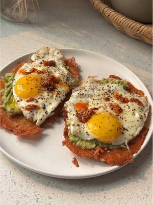Breakfast Hasbrown Tacos 🌮  Instead of a regular tortilla base, we’re building them upside down. Starting with melty shredded cheese crisped on the griddle, topped with a crispy hashbrown patty, then loaded with creamy avocado, a fried egg, chili onion crunch, or whatever toppings your heart desires. Recipes are always on the blog! Link in bio!! https://basicswithbails.com/course/breakfast/breakfast-hashbrown-tacos/ #breakfasttaco #easybreakfastideas #easybreakfastrecipe #hashbrownpatties #breakfasttacos
