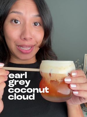 earl grey coconut cloud #fyp #tea #earlgrey  ingredients — 1 serving • 2 earl grey tea bags  • 2 oz (60 ml) hot water • agave nectar, to taste • 2 oz (60 ml) heavy whipping cream • 8 oz (240 ml) coconut water • ice how to make it: 1. to a small heat safe glass, add the tea bags and hot water and let it steep for 3-5 minutes. 2. to a small bowl/cup, add the agave nectar and heavy whipping cream and froth until it becomes light and airy. 3. to your glass, add the ice, coconut water, and the earl grey tea. 4. top with your sweet cream, stir, & enjoy!