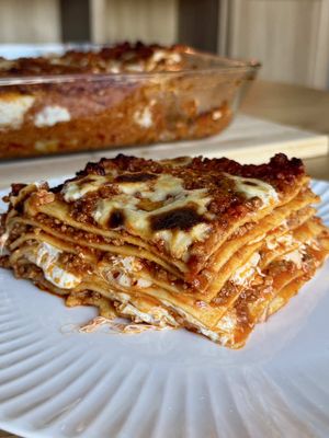 This is not your normal lasagna… this is Lasagna Bolognese 🇮🇹 Fresh pasta layered with slow-cooked ragù, creamy besciamella, mozzarella, and Parmigiano. The real Italian classic from Bologna.  Ingredients:  Ragù alla Bolognese 1 lb ground beef 1 lb ground pork 6 oz pancetta, cubed 1 knob butter 1 onion, finely diced 2 carrots, finely diced 2 celery stalks, finely diced 1 cup dry white wine 2 tbsp tomato paste 2 cups tomato passata 2 cups vegetable stock 2 bay leaves Salt & black pepper Pinch nutmeg 1 cup whole milk, warm Besciamella 500g whole milk 50g butter 50g flour Salt & black pepper Pinch nutmeg Lasagna 1 lb fresh lasagna sheets 1 lb fresh mozzarella, cubed Parmigiano Reggiano Instructions:  Make the Ragú: Cook pancetta slowly in a large pot until the fat renders. Add butter, onion, carrot, and celery, and cook until soft.  Add beef and pork, season and brown completely. Pour in white wine and let it fully evaporate. Stir in tomato paste and cook for 2 minutes.  Add passata, stock, bay leaves, and nutmeg. Lower the heat and simmer gently for 2 hours, stirring occasionally.  Stir in the warm milk and cook for another 30 minutes until silky and rich. Make besciamella: melt butter, whisk in flour, slowly add milk, stir on low heat until thick and smooth, season with salt, pepper, nutmeg. Layer in dish: Spread a thin layer of ragù on the bottom of the baking dish. Add pasta sheets, then ragù, besciamella, mozzarella, and Parmigiano.  Repeat layers until the top. Finish with ragù, besciamella, and Parmigiano Bake 400°F: 30 min covered, 15 min uncovered, 10 min broil. #pasta #EasyRecipe #fyp 