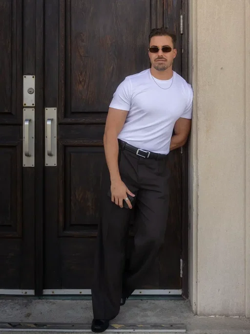 A simple fitted tee, wide leg pleated trousers, and a good pair of loafers is all a man needs.  #memsfashion #style #pleatedpant #QuietLuxury #MensStyle 