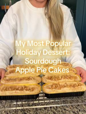 These Sourdough Apple Pie Cakes are my ultimate holiday party flex 🍏✨. They’re the dessert I always bring because everyone loves them, raves about them, and yes… strokes my ego a little 😏. Soft sourdough cake base baked with gooey apple pie filling inside, topped with cinnamon cream cheese icing and even more apple pie filling. Save this for your fall and holiday bakes—you’ll thank me later! 🍏 Sourdough Apple Pie Cakes Base Batter 	•	1 stick (113 g) unsalted butter, melted 	•	110 g active sourdough starter 	•	1 large egg 	•	180 g sour cream 	•	5 g vanilla extract 	•	200 g all-purpose flour 	•	200 g raw cane sugar 	•	10 g baking powder 	•	3 g baking soda Apple Pie Filling (make full batch; use ⅔ inside, ⅓ on top) 	•	400 g diced apples (about 4 medium) 	•	60 g (¼ cup) butter 	•	100 g (½ cup) brown sugar 	•	2 tsp cinnamon 	•	½ tsp nutmeg 	•	1 tbsp flour  Cream Cheese Cinnamon Icing 	•	115 g (4 oz) cream cheese, room temp 	•	60 g (¼ cup) unsalted butter, room temp 	•	80 g (⅓ cup) brown sugar 	•	60 ml (¼ cup) whole milk (or cream) 	•	1 tsp vanilla extract 	•	1 tsp ground cinnamon 	•	Pinch of salt   Instructions 	1.	Cook the apple filling – Melt butter in skillet. Add diced apples, cook 2 min. Stir in brown sugar, cinnamon, nutmeg, and salt. Cook until tender + glossy (about 5 min). Then add flour and cook until it thickens (about 3 minutes). Let cool slightly. 	2.	Make the batter – Whisk melted butter + starter until smooth. Add egg, sour cream, and vanilla. Mix well. 	•	Sprinkle in flour, sugar, baking powder, and baking soda one at a time, folding after each. 	•	Fold in ⅔ of the apple filling. 	3.	Bake – Divide into 12 tulip liners. Bake at 400 °F for 15-20 minutes, checking at 18. Done at 195 °F internal temp. 	4.	Icing – In a saucepan, whisk brown sugar, milk, and salt. Cook until sugar dissolves and slightly thickens, add vanilla immediately. Cool completely. Beat with cream cheese, cinnamon + butter until smooth.. Chill 20-30 min to thicken. 	5.	Finish –  Pipe on cream cheese icing, top with remaining apple pie filling, then graham cracker crumbs and cinnamon. ✨ Gooey, spiced, tangy little apple-pie cakes that will make you the star of every fall and holiday party. #sourdoughrecipes #applepiecakes #fallbaking #holidaydesserts 