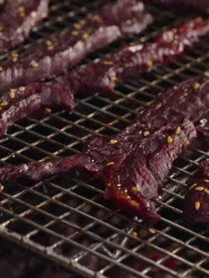 Forget the gas station stuff — this slow-smoked beef jerky is next level. Marinated to perfection, sliced with precision, and smoked low & slow for 4–5 hours. Tender, smoky, and packed with flavor — the ultimate protein snack. Tap the link in bio for recipe. #TraegerGrills #TraegerBBQ #TraegerRecipes