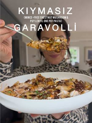 Okay, welcome to another episode of “Simple Twists” where I take some of my most popular recipes, or some really traditional ones, and give them a proper “Meliz’s Cooks” twist. Today is the turn of my ever-popular Kıymalı Garavolli (One Pot Lamb Mince & Pasta) which I have given a simple twist to make it “Kıymasız Garavolli” (One Pot Mince-Free Chestnut Mushroom & Puy Lentil Conchiglie Pasta). It is genuinely INCREDIBLE, flavour-packed, umami laden, and dare I say it, you won’t miss the mince at all! Ingredients below, method on the video, FULL RECIPE ON MY BLOG, link in bio, please make it.  Serves 4 GARLIC YOGHURT: 1 tsp finely grated garlic 150 g thick set natural yoghurt 1/4 tsp sea salt flakes TOPPING:  100 g (3½ oz) hellim (halloumi), finely grated 1 tsp dried mint ONE-POT PASTA:  1 vegetable stock cube + 1.2 litres (2 pints) boiling water OR 500ml fresh vegetable stock / broth + 600ml boiling water  3 tbsp olive oil 2 onions, finely chopped 3/4 tsp sea salt flakes 1 tsp ground cumin 1 tsp paprika 1/4 tsp ground cinnamon 1 tsp finely grated fresh garlic  1 tsp tomato purée 400g chestnut mushrooms, finely chopped, 1cm dice 250g vac-packed, cooked put lentils  1 tsp pomegranate molasses 1 tsp balsamic vinegar  ½ tsp ground black pepper 300 g (10½ oz) conchiglie pasta 2 bay leaves 25 fresh flat leaves parsley, finely chopped  CHILLI BUTTER: 50g unsalted butter 1 tbsp extra virgin olive oil 1 tbsp sweet (mild) red pepper paste (tatlı biber salçası) 1 tsp pul biber 1 tsp dried mint METHOD  Dissolve the stock cube in the boiling water in a heatproof jug and leave to one side. Mix together the garlic yoghurt ingredients in a small bowl, cover and refrigerate until later.  Combine the finely grated hellim and dried mint in a small bowl.  Heat the olive oil in a pan over a medium heat and add the onions. Sprinkle in half of the salt, stir, and soften the onions for 10–12 minutes until they turn a lovely light golden-brown colour. Add the cumin, paprika, ground cinnamon to the softened onions, stir well so that the spices release their aromatics, then stir through the garlic, followed by the tomato purée, ensuring the onions are fully coated.  Add the mushrooms to the pan, and stir constantly so all the flavours and ingredients in the pan integrate with the mushrooms, slowly helping them to soften down. Increase the heat a little, season with remaining salt and keep softening the mushrooms until they reduce by about half and are rich and juicy in colour. Add the pomegranate molasses and balsamic vinegar to the mushrooms, stir well, then the puy lentils, stirring again then add the pasta, stirring gently so that the sauce starts is mixed through the hard pasta shells.  Gently pour in the stock, stir, add the bay leaves, bring to the boil, then reduce to a medium simmer for 10–12 minutes. Stir a couple of times as it cooks, being careful not to break apart the pasta shells. Once the pasta is cooked through (but still al dente) and the liquid has mostly reduced but is still “saucy”, remove the pan from the heat and give it a gentle stir. While the pasta cooks, prepare the chilli butter. Melt the butter in a frying pan over a medium heat, then add the olive oil. When it starts to sizzle, stir through the sweet red pepper paste, pul biber and dried mint. Let it just start to bubble, then remove from the heat. Serve the pasta on plates with a sprinkling of the hellim and mint mixture, a dollop of the Garlic Yoghurt and a drizzling of the Chilli Butter. #pasta #hellim #EasyRecipe #dinner #fyp       