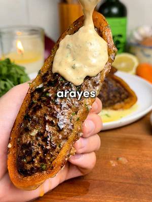 Arayes 🔥  Full recipe linked in bio for free with no ads 🫡  Crispy, Juicy Middle Eastern Meat-Stuffed Pitas with a Garlic Tahini Sauce. Imagine if a pita and a burger had a beautiful, crispy, garlicky baby. Crunchy on the outside, juicy and deeply spiced on the inside. Shockingly easy but wildly flavorful. Ingredients -4 small pitas, cut in half -1 yellow onion, grated & squeezed dry -7 garlic cloves, minced -2 tbsp tomato paste -1/3 cup fresh parsley, chopped -1/3 cup fresh cilantro, chopped (optional but excellent) -1 tbsp olive oil -1 lb (0.45 kg) lean ground beef -Spices: 1 tsp salt, 1 tsp black pepper, 1 tsp cinnamon, 2 tsp cumin, 2 tsp paprika, 1 tsp allspice For the Garlic Tahini Sauce: -1/2 cup Greek yogurt -3 tbsp tahini -1/2 lemon, juiced -2 garlic cloves, minced -2 tbsp olive oil -1/4 cup fresh parsley, chopped -1/4 cup fresh cilantro, chopped -1 tsp each: cumin, salt, pepper, paprika Full recipe with instructions linked for free in my bio. 