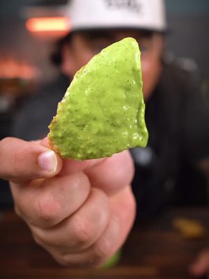 This one’s gonna blow your mind. We are making another version of a “salsa falsa” and honestly a great way to sneak some veggies into taco time. #salsa101 recipe below 👇🏽  Ingredients YIELD: 3 cups To Boil: 300 g water (about 1 ¼ cups) 355 g tomatillos, whole (about 6–7 medium tomatillos) 130 g zucchini, cut into tomatillo-sized pieces (about 1 small zucchini) To Fry: 150 g neutral oil (about ⅔ cup) 175 g serrano chiles, stems removed (about 12–14 chiles) 125 g white onion, large dice (about ½ large onion) 70 g garlic, whole cloves peeled (about 12 cloves) 70 g cilantro (about 1 small bunch, leaves and tender stems) 10 g Diamond Crystal kosher salt (about 2 tsp) Instructions 1️⃣ Boil the Veggies In a pot, add water, tomatillos, and zucchini. Cover and cook over medium heat until tender (about 15 minutes). Remove from water, discard liquid, and set aside the vegetables. 2️⃣ Fry the Aromatics In a sauté pan, combine oil, serranos, onion, and garlic. Turn heat to medium and cook while stirring until everything is golden and tender (about 10 minutes). Remove from heat and cool at room temp. 3️⃣ Blend Until Smooth In a blender, combine boiled tomatillos and zucchini with the fried mixture, cilantro, and salt. Purée on high until super creamy. Taste and adjust seasoning as needed.