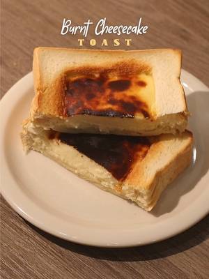 🧀🍞 Burnt Cheesecake Toast 📝 Recipe 1 Slice • Thick Sliced of Bread 150g • Cream Cheese (room temperature) 40g • Sugar Vanilla Extract 1 Egg 75g • Whipping Cream 4g • Cornstarch 👩‍🍳 equipments needed: aluminium foil, airfryer/oven *note: you can use this recipe with 2 slices of thick bread! Instructions: • Bread - make a space in the middle of the bread by cutting it square in middle like in the video - then flatten the middle with spoon  - wrap the bread with aluminium foil and cut open the space in the middle  • Cheesecake Batter - put cream cheese on a bowl, sugar, and vanilla extract then mix everything with spatula - crack open one egg then mix - pour whipping cream then mix  - put cornstarch then mix again • Bread + Cheesecake Batter - pour cheesecake batter on the bread • Baking; Cheesecake Bread - bake the cheesecake bread in the air-fryer at 180°C for 20-30 minutes / in the oven at 200°C for 30-40 minutes  • Finishing; Burnt Cheesecake Toast - serve the burnt cheesecake toast on a plate and enjoy! — #homecafe #asmr #cheesecake #toast #EasyRecipe 