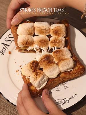 🍫 S’mores French Toast 📝 Recipe 2 Slices • Bread Chocolate Bar of your choice 1 Egg 30ml • Milk 4 pieces • Crackers / Biscuits 1 tbsp • Butter 9 Pieces • Small Marshmallows Instructions: • Bread + Chocolate - stack both of the breads with chocolate bar inside the bread • Egg Mixture - crack open 1 egg and pour milk - whisk everything • Biscuit - crush biscuits for coating • Dipping and Coating - dip the bread inside the egg mixture - coat the bread with crushed biscuits • Cooking; Bread - put stove in medium heat - melt the butter once the pan is hot - fry the bread on both sides until the bread is cooked • French Toast + Marshmallow - put marshmallows on top of the french toast - air-fry the french toast to melt the marshmallows for 7 minutes at 150°C or use torch to melt the marshmallows — #homecafe #marshmallow #asmr #frenchtoast #smores 