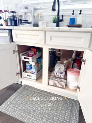Decluttered under our kitchen sink ✨ The old way I had everything organized from our previous house just doesn’t work in this cabinet. All of our kitchen cabinets are smaller in this house so I’m having to completely re-do how I organize everything and really prioritize what we keep in each one. Which really means I’ve just got a lot of decluttering to do 😂✨ I really like the new organizer I got for the side of the cabinet a lot! It’s nice to use the height of the cabinet since we don’t have as much width so this works well for us! I think I got us down to just what we use on a weekly basis for cleaning in this cabinet so I feel pretty good about what I’m keeping in here! #declutter #decluttering #kitchencabinets #kitchenorganization #declutterwithme  