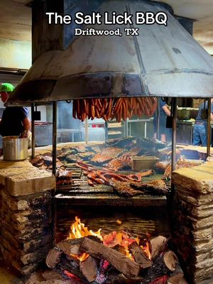 ✨ Texas BBQ ✨ @Salt Lick BBQ is Texas barbecue history served with a side of charm. 🔥   Since 1967, the Roberts family has been slow-cooking brisket, sausage, and ribs over open oak pits using a legendary sauce that has no tomato — so it caramelizes perfectly over the fire. Their original hand-built pit is still in use today! You can enjoy all-you-can-eat BBQ (brisket, pork ribs, sausage + classic sides) for around $33.95 per person, available for both lunch and dinner at their Driftwood and Round Rock locations. It’s BYOB — or you can walk next door to Salt Lick Cellars to grab a glass of wine or a local beer before you feast. 🍷🍺 #saltlickbbq #bbq #texasbbq #texas #texascheck 