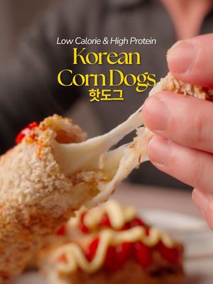 #ad Korean Corn Dogs (3 Servings)   Dempster has released their newest protein bread! With 14g of protein, your days are definitely going to be fuelled and balanced  @Dempster’s Bakery  Per Skewer: ~198 kcal | 16g P | 20g C | 6g F   Ingredients • 1½ Turkey Sausages (~63g) • 42g Light Mozzarella (1.5 oz) • 3 slices Dempster Protein with Whole Grains Loaf (crusts removed) • 1 Egg, 15g Panko • 1 tbsp Light Mayo, 1 tbsp Sugar-Free • Ketchup • 1 tsp Stevia   Directions:   1. Roll bread flat. Place sausage bottom, mozzarella top   2. Brush edges w/ egg wash, roll tightly, seal.   3. Dip in egg wash → panko. Insert skewers.   4. Air fry 375°F 10-12 min, flip halfway.   5. Drizzle mayo + ketchup, sprinkle stevia, serve hot. #DempstersProtein #hyperfixationmeals #nourishwithdempsters #bakedincanada