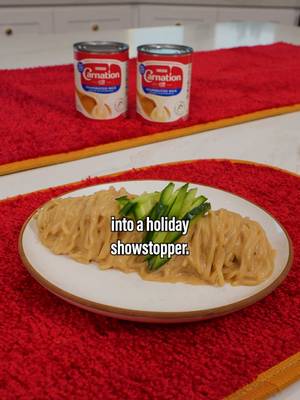 #CarnationPartner Today we’re using @Carnation Milks Evaporated Milk to make our already delicious peanut noodles, even creamier. This dish deserves to take center stage, so I’m serving them on Carnation’s limited edition Red Carpet Recipe Collection which includes an apron, a table runner, placemats and an apron made from Hollywood’s real red carpet. #CarnationMilks   Ingredients (4 servings) - Peanut Butter (½ cup) - Light Soy Sauce (¼ cup) - Dark Soy Sauce (1 ½ tbsp) - Rice Vinegar (2 tbsp) - Sesame Oil (1 ½ tbsp) - Garlic (4 cloves) - Ginger (1 inch knob) - Sugar (2 tbsp) - Salt (tt) - Carnation Evaporated Milk (½ cup) - Fresh Noodles (800g) - Cucumber (for garnish) Instructions - Combine peanut butter, light soy sauce, dark soy sauce, rice vinegar, sesame oil, grated garlic, grated ginger, sugar, and salt. Whisk together.  - Gently warm up Carnation Evaporated Milk. - Pour warm evaporated milk over sauce and mixed together.  - Boil fresh noodles according to package directions.  - Pour sauce, overcooked noodles and gently mixed together.  - Divide up noodles equally into four bowls and top each one with thinly sliced cucumber. 