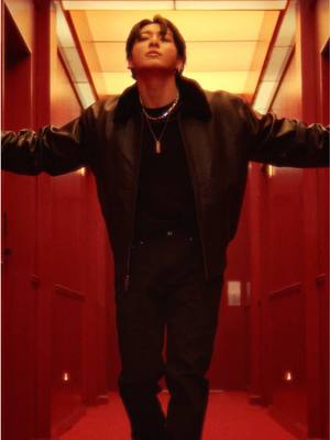 Jung Kook slips into leather. Warm up holiday nights in the cotton tee, tapered jeans and shearling-trimmed leather jacket.