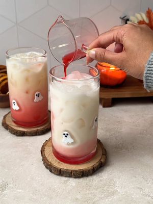 make these hauntingly pretty mocktails for spooky season, made with creamy @Califia Farms Organic Coconutmilk 👻✨ #califiapartner  🥥 to a shaker, add 100ml pineapple juice, 35ml lime juice, and 70ml Califia Farms Organic Coconutmilk  🥥 shake until combined and pour into a glass  🥥 top with more ice and Coconutmilk  🥥 pour in 1 tbsp grenadine and garnish with a dehydrated orange slice 