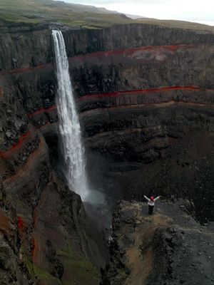 Yet another reason why Iceland is in fact another planet… 💭 Make sure you SAVE this for your own trip and follow for more adventures like this.  This is…📍Hengifoss  Iceland is home to literally thousands of waterfalls, everywhere you look you are bound to see them. BUT this has to be one of the most unique and dramatic.  Details on visiting👇🏼 There is a marked trail from the car park leading you to the base of the falls. Now, whilst the view from the base is beautiful, the drama of this falls really comes alive from a little higher up.  There is no marked trail to reach this ledge that you see in the video, but it’s to the left of the falls. Other than that it’s really a case of go find a route, if you really want to get to it. Be super cautious and don’t walk too close to the edge of the cliffs!!  We spent over 1 hour climbing to this viewpoint and jumping over rivers along the way. But that’s all part of the adventure, trust us it’s worth it when you find it 🙌🏼 Have you visited this falls yet?  #iceland #icelandtravel #icelandwaterfalls #fyp #hengifoss #icelandnature 
