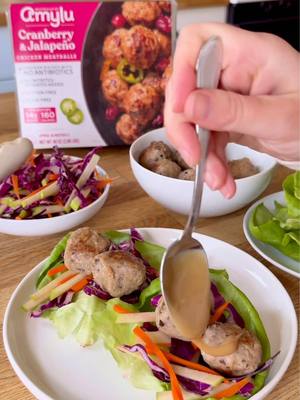 Our Cranberry Jalapeño Chicken Meatballs are back at Costco for a limited time! Try them in lettuce wraps for a quick, flavorful meal :) Full Recipe: Cranberry Jalapeño Meatball Lettuce Wraps Prep Time: 15 minutes Cook Time: 5 minutes Yield: 4 servings (8 lettuce wraps) Ingredients Lettuce Wraps ● 2 teaspoons extra virgin olive oil ● 16 Amylu Cranberry & Jalapeño Chicken Meatballs ● 8 butter lettuce leaves ● Sliced green onions, for topping Apple Cabbage Slaw ● 1 1⁄2 cups sliced red cabbage ● 1⁄2 large Granny Smith apple, cut into matchsticks ● 1⁄2 cup carrots, cut into matchsticks ● 1 teaspoon extra virgin olive oil ● 1 teaspoon apple cider vinegar ● pinch of sea salt Maple Tahini Sauce ● 2 tablespoons tahini ● 1 tablespoon pure maple syrup ● 1 teaspoon apple cider vinegar ● pinch of sea salt ● splash of water, as needed Instructions 1. Heat the olive oil in a large nonstick skillet over medium heat. Add the meatballs and cook, turning occasionally, until warmed through and lightly browned, about 5 minutes. 2. In a large bowl, toss together all the ingredients for the cabbage slaw. Set aside. 3. In a small bowl or jar, stir or shake the tahini, maple syrup, apple cider vinegar, and sea salt until fully combined. Add a splash of water and stir, as needed, until desired consistency. 4. Assemble the lettuce wraps by filling each butter lettuce leaf with a scoop of the apple cabbage slaw, a couple meatballs, a light drizzle of maple tahini sauce, and top with sliced green onion. 5. Serve warm and enjoy.