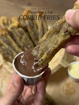 Brown Butter Chocolate Chip Cookie Fries with chocolate and white chocolate dip🤤 Ingredients •3/4 cup (168 g) unsalted butter* •1 cup (200 g) packed light brown sugar •1/4 cup (50 g) granulated sugar •1 large egg + 1 large egg yolk, at room temperature •1 tablespoon pure vanilla extract •1 3/4 cup (220 g) all-purpose flour •3/4 teaspoon baking soda •3/4 teaspoon kosher salt + more flaky seat salt for sprinkling •1 1/2 cups (255 g) semi sweet chocolate chips or chocolate cut into tiny pieces INSTRUCTIONS: •Place the butter in a small saucepan and set over medium low heat. Low heat is key to an even, golden browning! Use a silicone spatula to stir and scrape the butter from the bottom and sides of the pan every 10 to 15 seconds. At first, the butter will melt and foam, then over time the foam bubbles will get smaller and the butter will begin to emit a warm, nutty aroma. Continue to cook the butter, occasionally stirring and scraping with your spatula, until the butter begins to take on color and you see small floating brown bits, about 5 to 7 minutes (these are the milk solids in your butter separating and toasting). Once the butter is golden brown, remove it from the heat and allow it to cool in the saucepan for a few minutes. •In a large mixing bowl, combine the brown butter, brown sugar, and granulated sugar. Use a silicone spatula to mix together. Add the egg, extra egg yolk and vanilla and mix well. •Add in the flour, baking soda, salt and fold until no streaks of flour remain, being careful not to overmix your batter. The dough should be soft but not sticky, so when you touch it with your finger, it gives just a little.  •Fold in the chocolate chips until evenly distributed. Do not over mix. Cover the bowl and place it in the fridge to chill for at least 1 hour (and up to overnight). •Remove the dough from the fridge and allow it to soften at room temperature until it’s scoopable (about 20 minutes). Preheat the oven to 350°F for 30 minutes. •Place a sheet of parchment paper on your work surface and spread the cookie dough evenly into a rectangle about 1–1.5 cm thick. Using a sharp knife, cut the dough into fry shapes roughly 8–10 cm long and about 1.5 cm wide. Carefully separate the pieces and arrange them on a parchment-lined baking tray, leaving space between each one.  •Bake until the cookie fries have puffed up and are light golden brown around the edges but still somewhat soft in the middle, 12 to 13 minutes. Remove the baking sheet from the oven (your cookie fries will spread while baking don’t panic as soon as you remove the tray from the oven, quickly shape them back into fries by pushing it from all the sides using a flat spoon)and allow the Cookies to cool completely before serving as warm cookies will break very easily. •Enjoy ✨ #cookie #viral #fyp #asmr #chocolate 