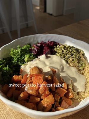 sweet potato harvest salad: 🍠🫜🥬🫶🏽 serves 4  280g quinoa  4 small - medium sweet potatoes  4 balls of pickled beetroot (cubed)  150g curly kale  60g pumpkin seeds  olive oil  salt and black pepper  for the dressing:  5tbsp tahini  2tsp apple cider vinegar  1tsp maple syrup  1tbsp coconut yoghurt  salt & black pepper  (a few splashes of water to thin for texture)  method:  to start chop your sweet potato’s into small cubes. place these into a baking dish with a generous amount of olive oil, salt and black pepper. bake in the oven at 180°C for 50 minutes to an hour.  meanwhile get your quinoa cooking in some salted water and place your kale in a large bowl with some olive oil and salt. massage this well and set aside.  to make the dressing simply mix all the ingredients together in a jar or bowl and add a splash or two of water to achieve the desired texture.  once the sweet potato has cooked place it in a large bowl along with the kale, cubed beetroot, pumpkin seeds and quinoa pour your creamy dressing on top and mix together well. store in the fridge until needed or eat right away. enjoy!  🫜🍠🥬🫶🏽 #healthy #salad #autumn #vegan #foryoupage 