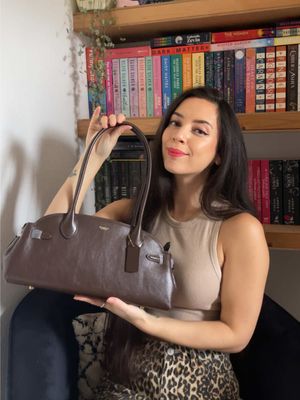 Coach Empire Carryall 34 bag unboxing 🥰🛍️ I’d been eyeing this up recently and spotted Farfetch had 25% off so it was obviously meant to be 🙌🏼 This is in shade Maple, a rich timeless brown leather and no unfortunately my iPhone 12 Pro Max doesn’t fit in the inside pocket 😅 Absolutely in love with the long arm straps and east-west shape  Coach is killing it atm, are you looking at any of their styles? #coachbag #coachunboxing #coachempire34 #browleatherbag