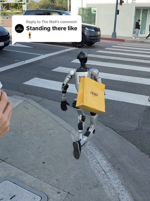 Replying to @The Mall Ariana what are you doing here?? #robot #teslabot #ai 