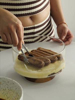 One of the best I’ve made (second attempts) better than the first 🥰 Here’s how you can make it at home 👇 Classic Tiramisu Recipe 🧈 Ingredients: 3 yolks (pasteurised egg) Egg whites  Sugar  Mascarpone cheese Ladyfinger biscuits Strong coffee or espresso (cooled) Cocoa powder (for dusting) ☕️ Step-by-step: 1. Whisk egg yolks and sugar and then on low heat keep stirring until mixture is thickened  2. Gently fold in mascarpone until smooth and creamy. 3. In another bowl, beat egg whites until soft peaks form, then fold into the mascarpone mixture. 4. Dip each ladyfinger lightly in coffee (don’t soak too long or it’ll fall apart) Layer coffee-dipped ladyfingers, then mascarpone cream. Repeat. Chill for at least 4 hours (overnight is best) Dust generously with cocoa powder before serving The kind of dessert that makes people go quiet for a moment. 🫶 #Tiramisu #ClassicDessert #ItalianDessert