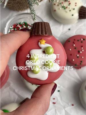 4 Ingredient Oreo Cookie Ornaments 🎄🎅🏻 Because we’re all about the minimal ingredients over here for our holiday baking!! These are so easy and so fun to make! INGREDIENTS - 12 Oreos 12 mini peanut butter cups 10 oz candy melts Sprinkles and candy for decorating DIRECTIONS - 1) Melt your white chocolate in a microwave-safe bowl in 30-second intervals. Dip each Oreo into the melted chocolate, ensuring it’s fully coated. Can use a typical dinner fork to allow excess chocolate to drip off. Place them on a parchment-lined baking sheet to set. 2) While the chocolate is still wet, shower your Oreo creations with festive sprinkles and add a mini reese’s peanut butter cup to the side. 3) Allow your chocolate-coated Oreo ornaments to set completely. Enjoy! #holidaybaking #christmasbaking #christmasdesserts #christmastreats #oreocookies   