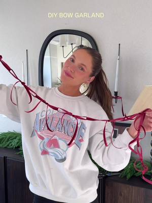 DIY bow garland with red velvet ribbon — so easy ! Would be so cute on a tree too! #bowgarland #DIY #christmasdecor 