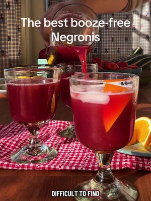 Here's how to make Nonalcoholic Negronis: • 1 medium navel orange • 10 hibiscus tea bags, such as Celestial Seasonings Red Zinger • 1 tablespoon whole black peppercorns • 1 tablespoon whole cloves • ½ cup sugar • 2 (12-ounce) cans tonic • 1 cup unsweetened grapefruit juice • Ice, for serving • Orange wedges, for serving Use a vegetable peeler to peel the orange, avoiding as much white pith as possible. In a small saucepan, combine the orange peel with the tea bags, peppercorns, cloves and 2 cups water. Bring to a boil over high heat. Add the sugar and cook, stirring, until dissolved, about 1 minute. Cover, remove from the heat and let cool completely, about 2 hours. Strain the tea and discard the solids. The cooled, brewed tea can be refrigerated in an airtight container for up to 2 weeks. To serve, in a large pitcher, stir together the tea, tonic water, grapefruit juice and about 1 cup ice. Divide among rocks glasses filled with ice and garnish with orange wedges. Tip: To make one serving, fill a rocks glass with ice. Pour in 1 ounce of grapefruit juice, 2 ounces of the tea and 3 ounces of tonic water; stir to mix. Garnish with an orange wedge.