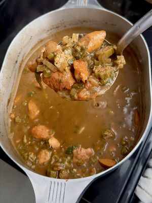 Now that we already covered Filé gumbo, let’s get into this Chicken and Sausage gumbo.  ✨ There are really two main types of gumbos: filé based gumbo and okra based gumbo.  ✨ Both are used to give gumbo their consistency , but a little filé in an okra gumbo goes a long way to give a whole new level of flavor and depth.  ✨ This recipe can be found in my cookbook on my website in my bio. ✨Note for this recipe, there was a mistake that says “6 lbs of okra” but it’s supposed to say “.6 lbs of okra”. Everything else is good. 😅 #creole #gumbo #risascuisine #louisiana #neworleans   